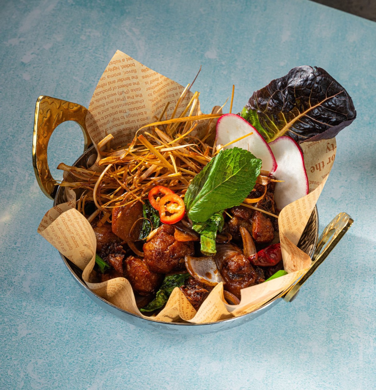 A warm, moody Thai curry dish served in the dining room